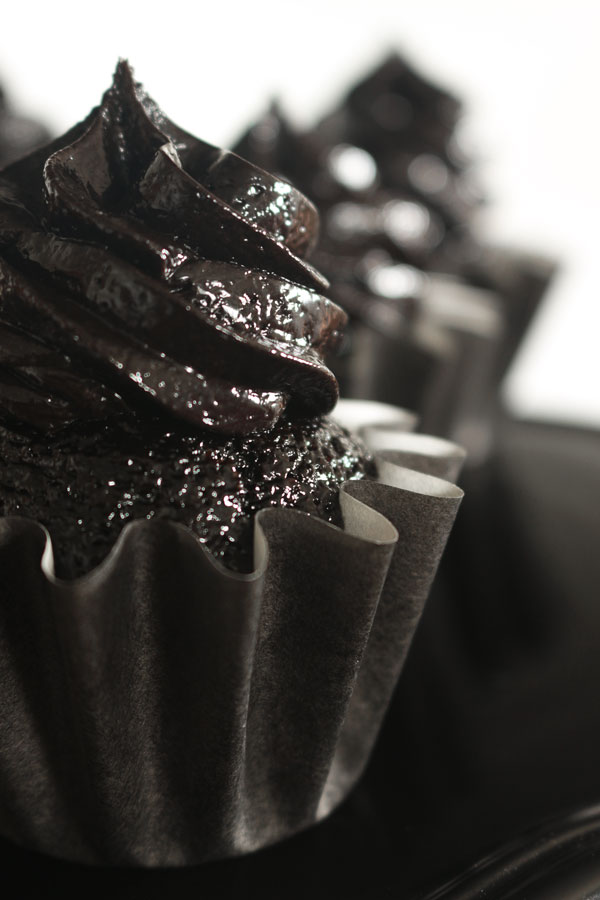The darkest chocolate cupcake recipe ever! These sweet and sexy cupcakes are a crowd pleaser every time!