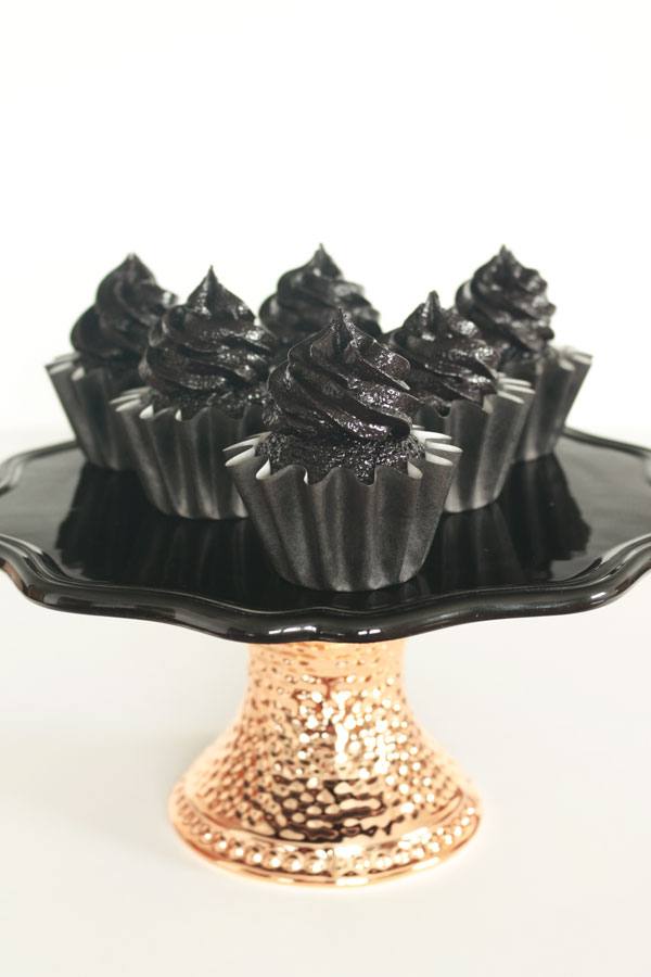 The darkest chocolate cupcake recipe ever! These sweet and sexy cupcakes are a crowd pleaser every time!