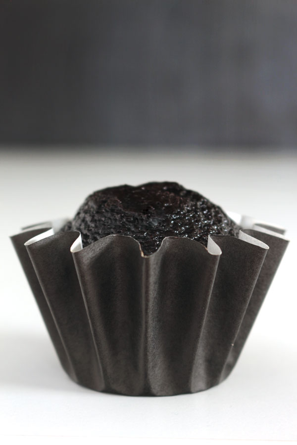 The darkest chocolate cupcake recipe ever! These sweet and sexy cupcakes are a crowd pleaser every time!