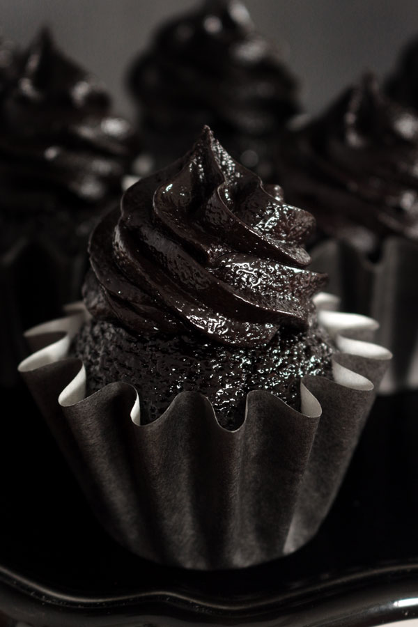 The darkest chocolate cupcake recipe ever! These sweet and sexy cupcakes are a crowd pleaser every time!